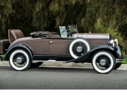 An antique car with an open top